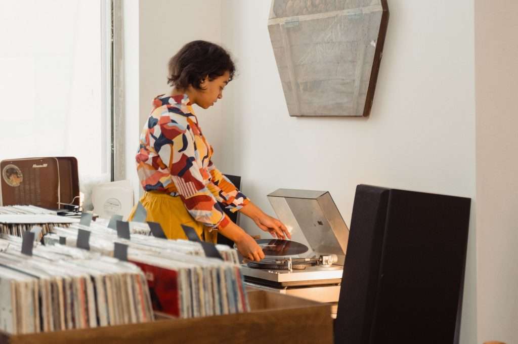 A woman using a record player