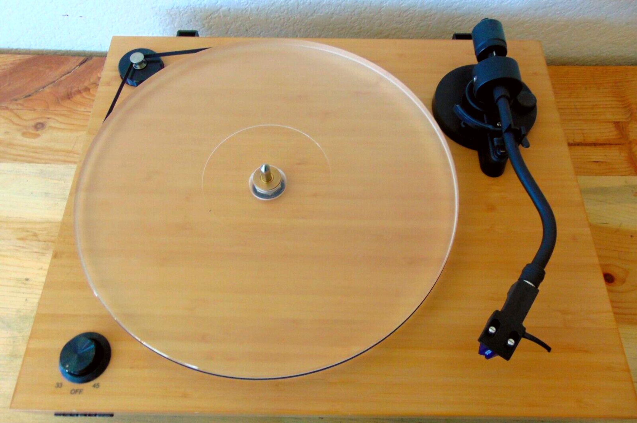 Fluance RT85 turntable in a light wood stain