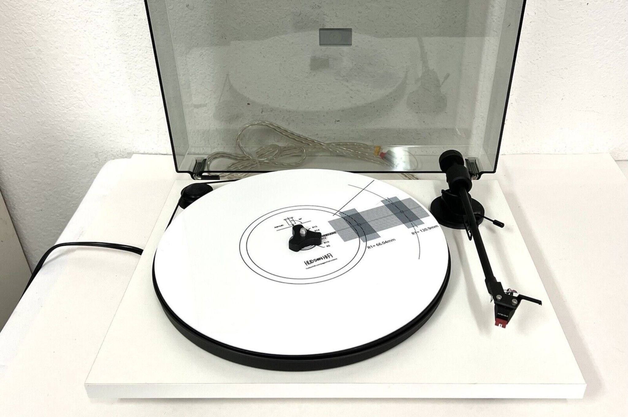 A white Andover Audio SpinDeck turntable
