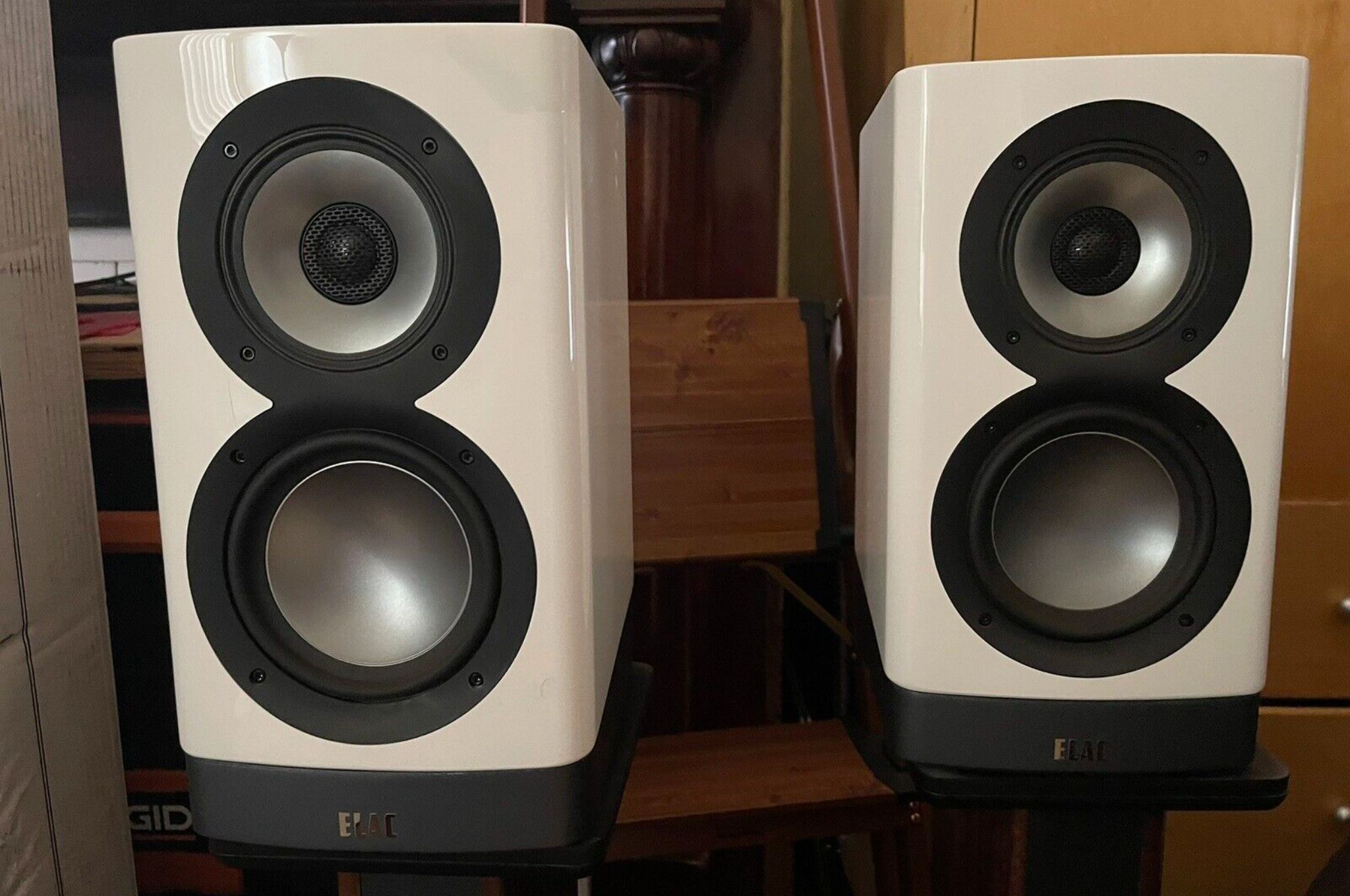 White ELAC ARB51-GB Navis speakers on stands